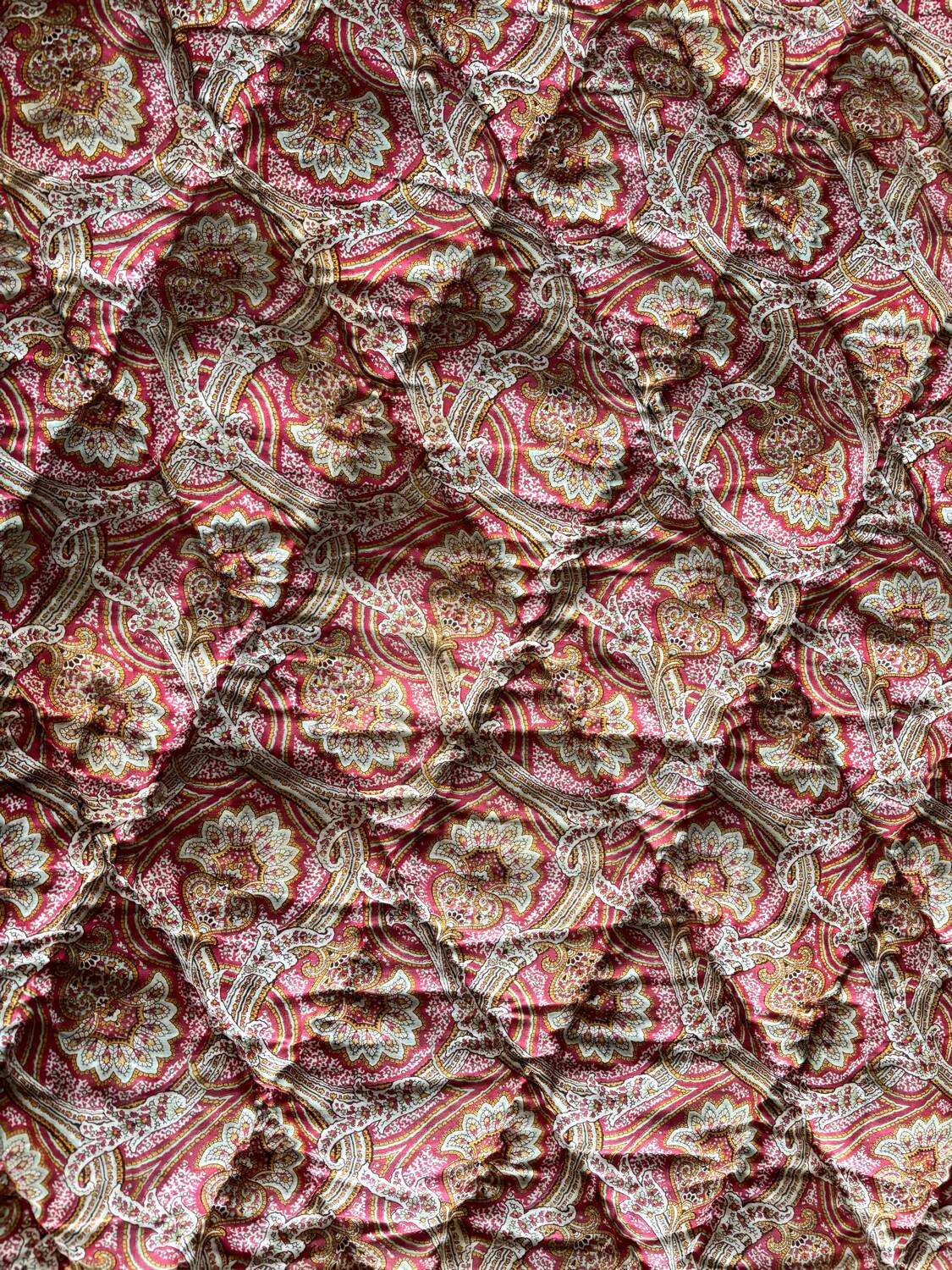 Vintage duvet/bedspread with a paisley pattern.