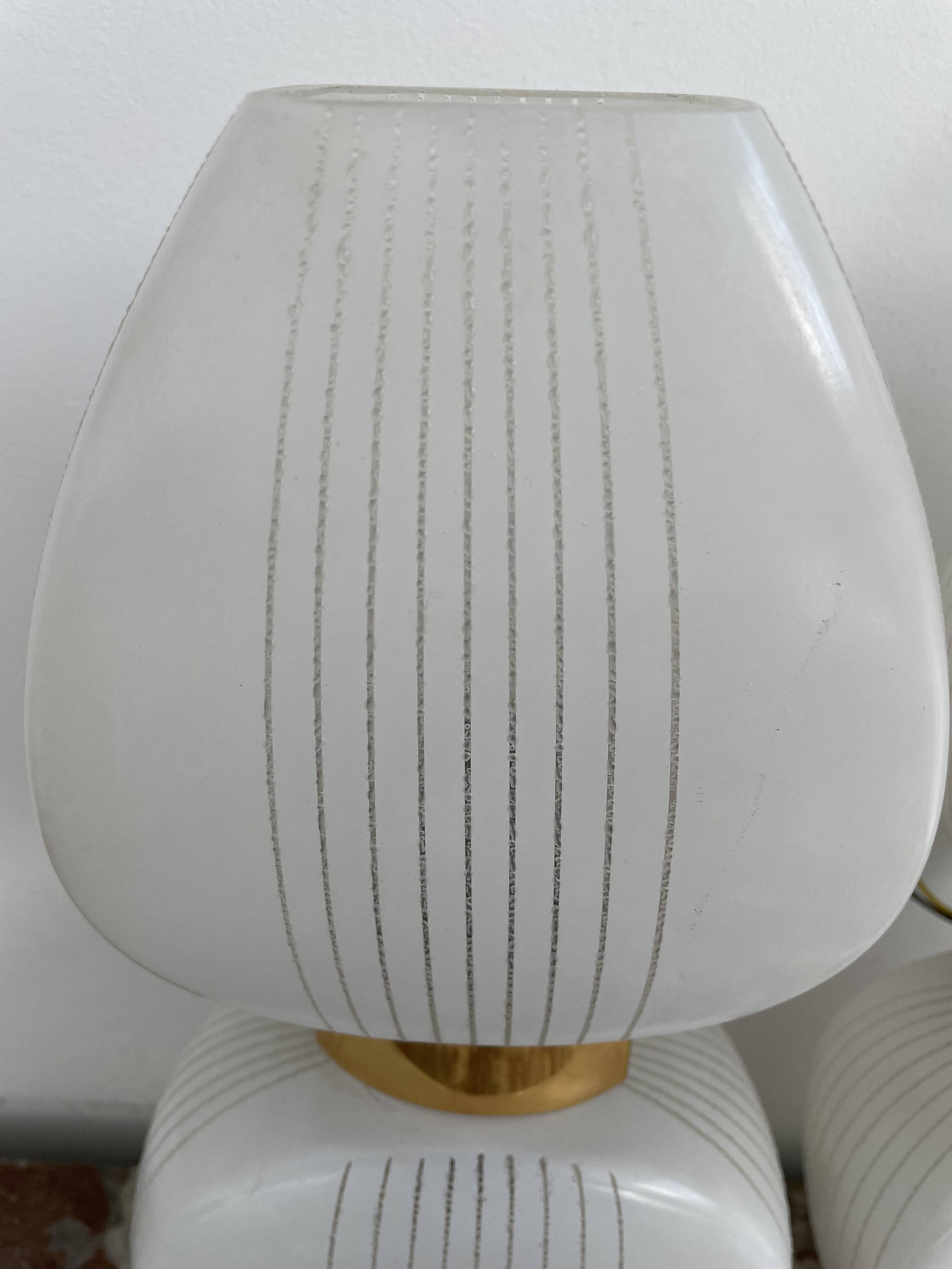 Pair of vintage wall lights from the 60s-70s in striped opaline glass and gilded brass.
