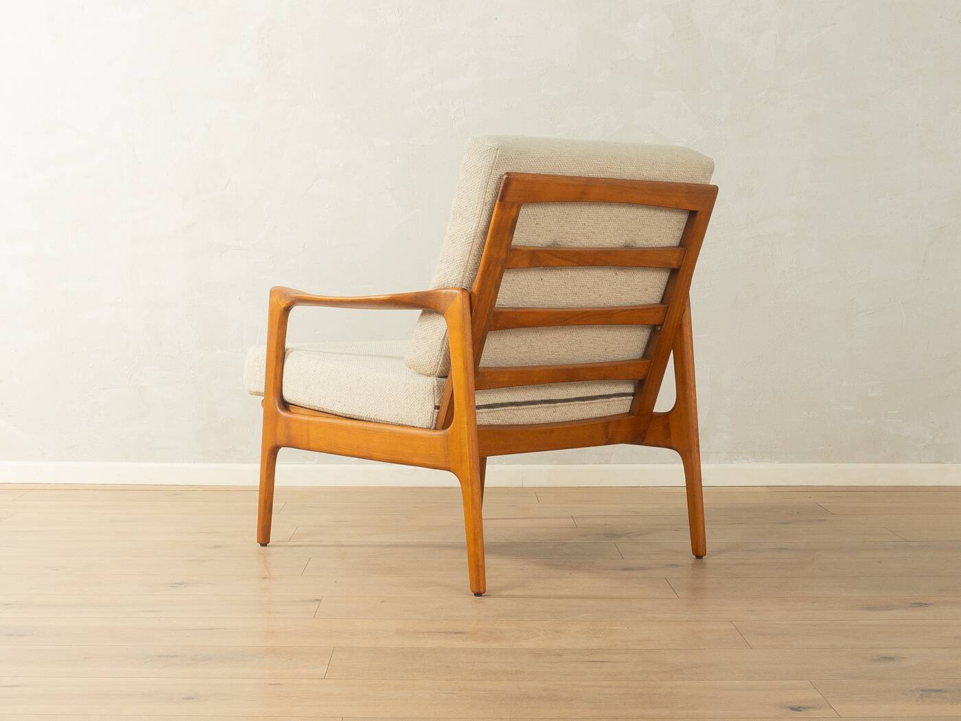 Elegant mid-century armchair from the 1960s with cream-white upholstery