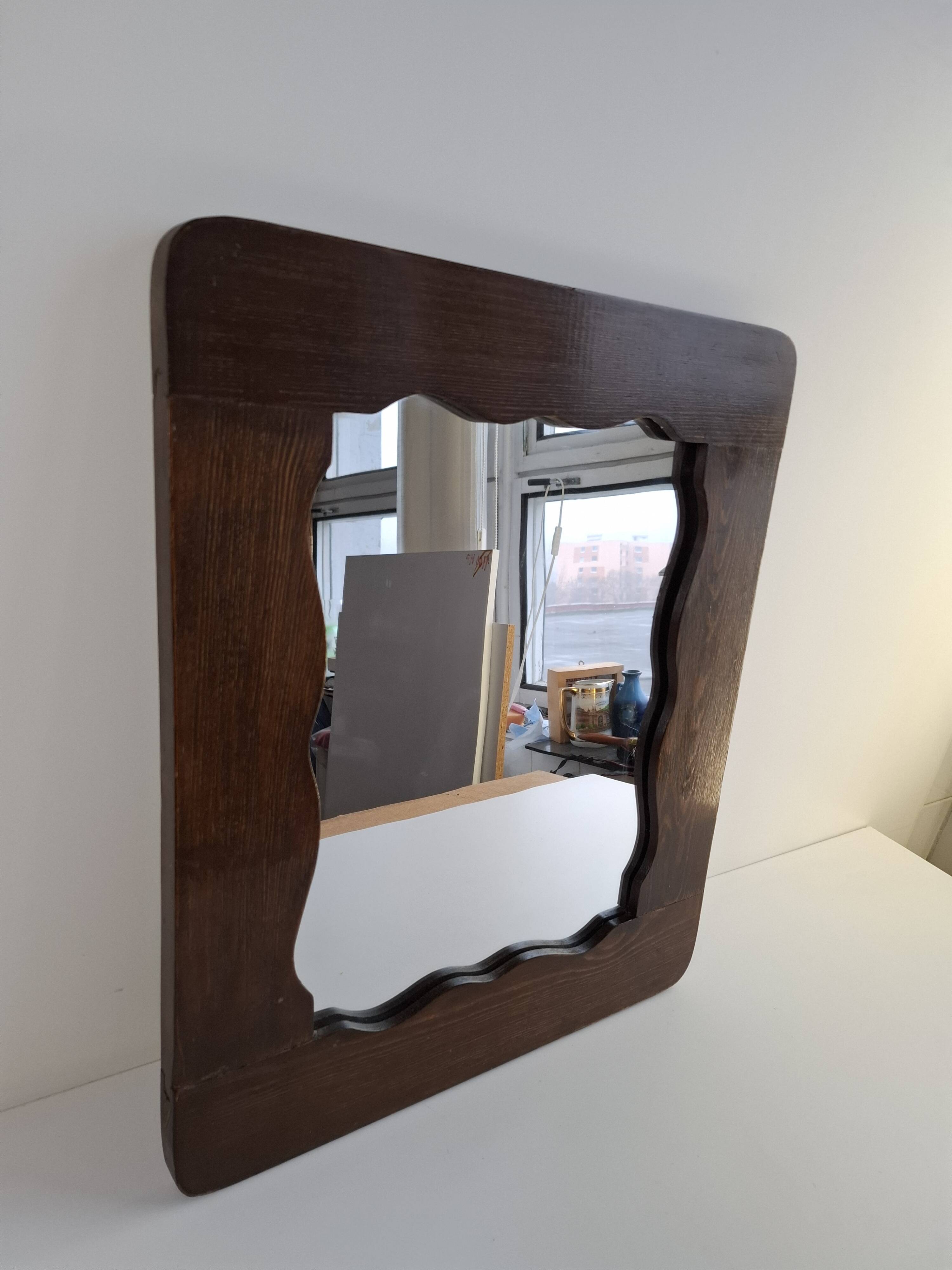 Czechoslovakian wall mirror with a wavy wooden frame, mid-century, 1940s
