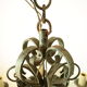 Lustre 8 branches en fer forgé patine gris de vert  et dorure ancien