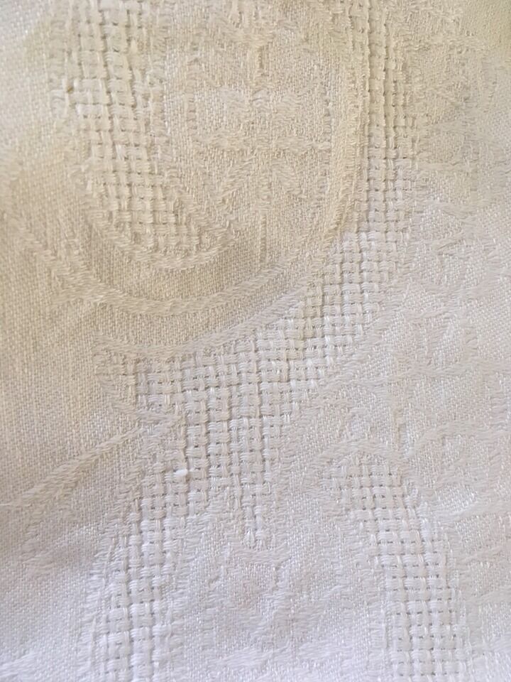 Old damascened white tablecloth