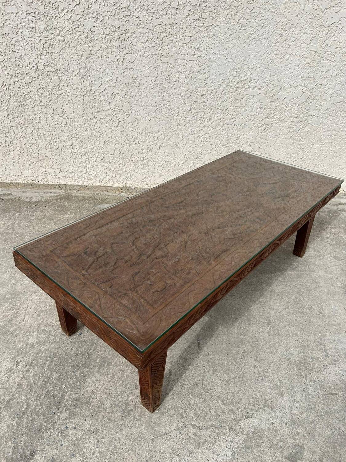 Afro style carved wooden table with glass top