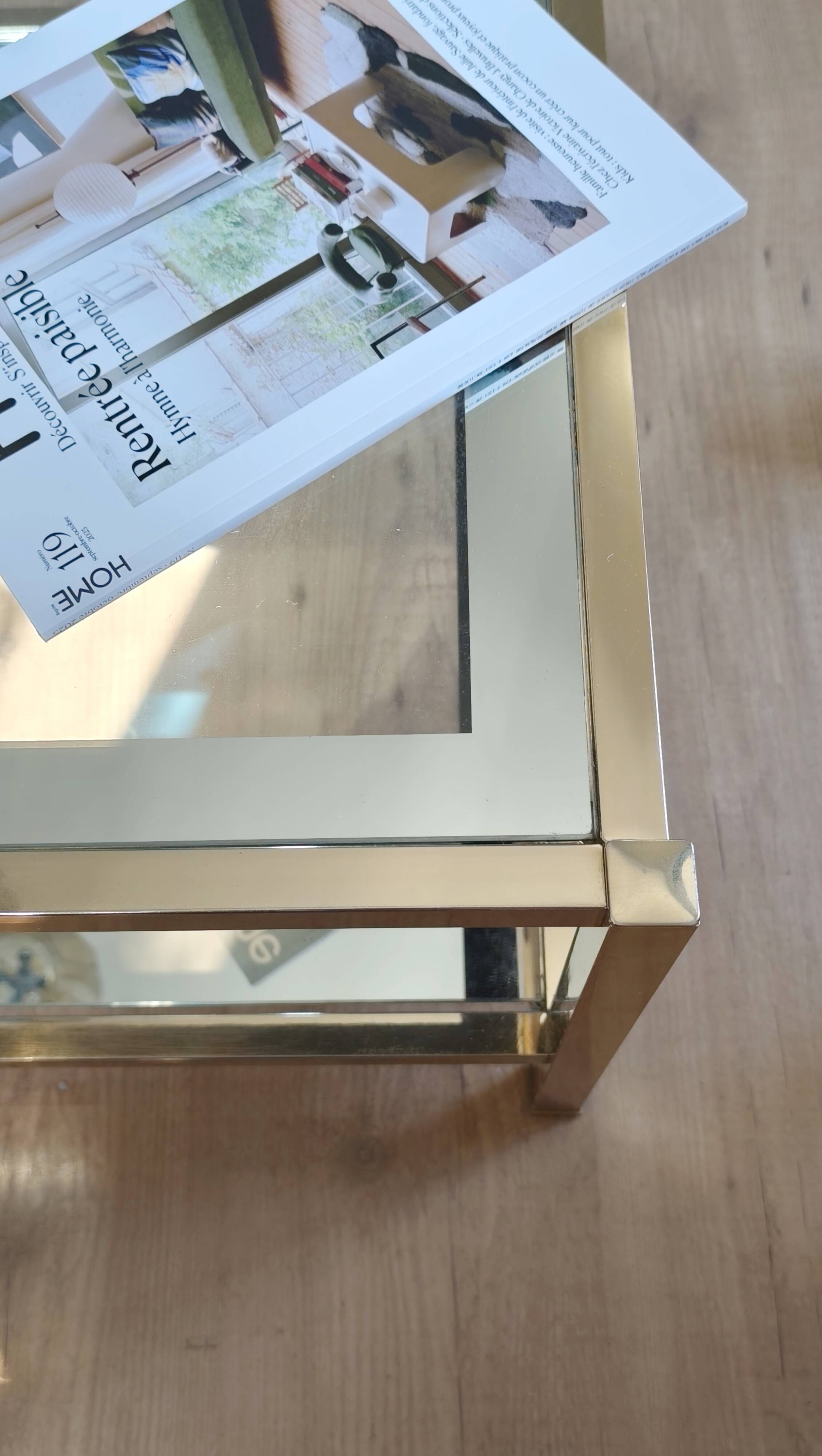 Vintage coffee table with glass, mirror, and brass.