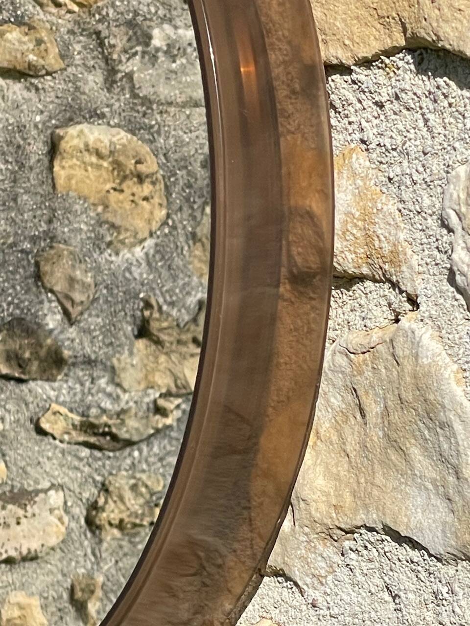 Vintage round smoked plastic mirror, circa 1970s.