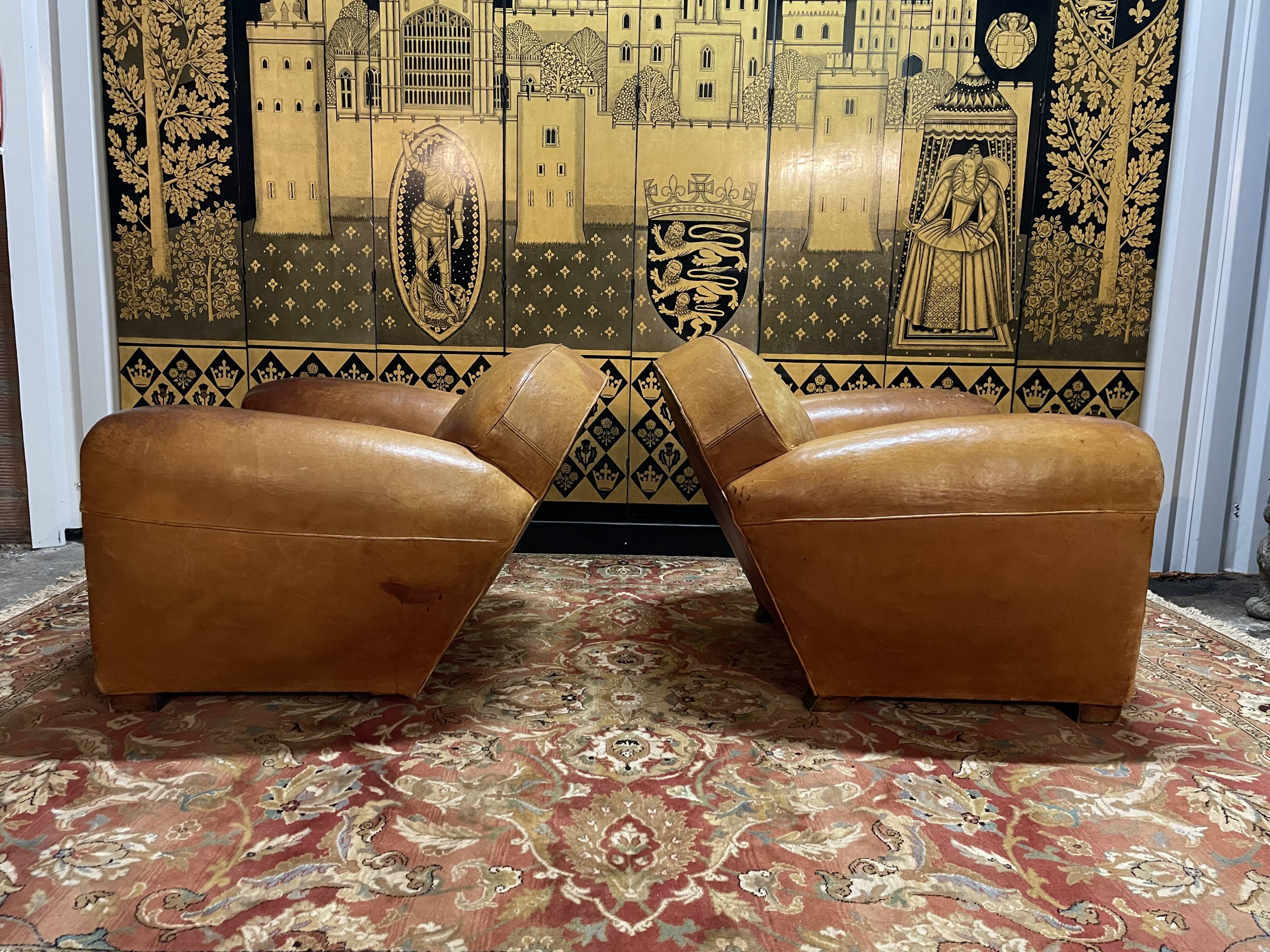 Pair of club armchairs in Havana leather 1950