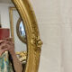 Miroir oval en bois doré 70x49cm