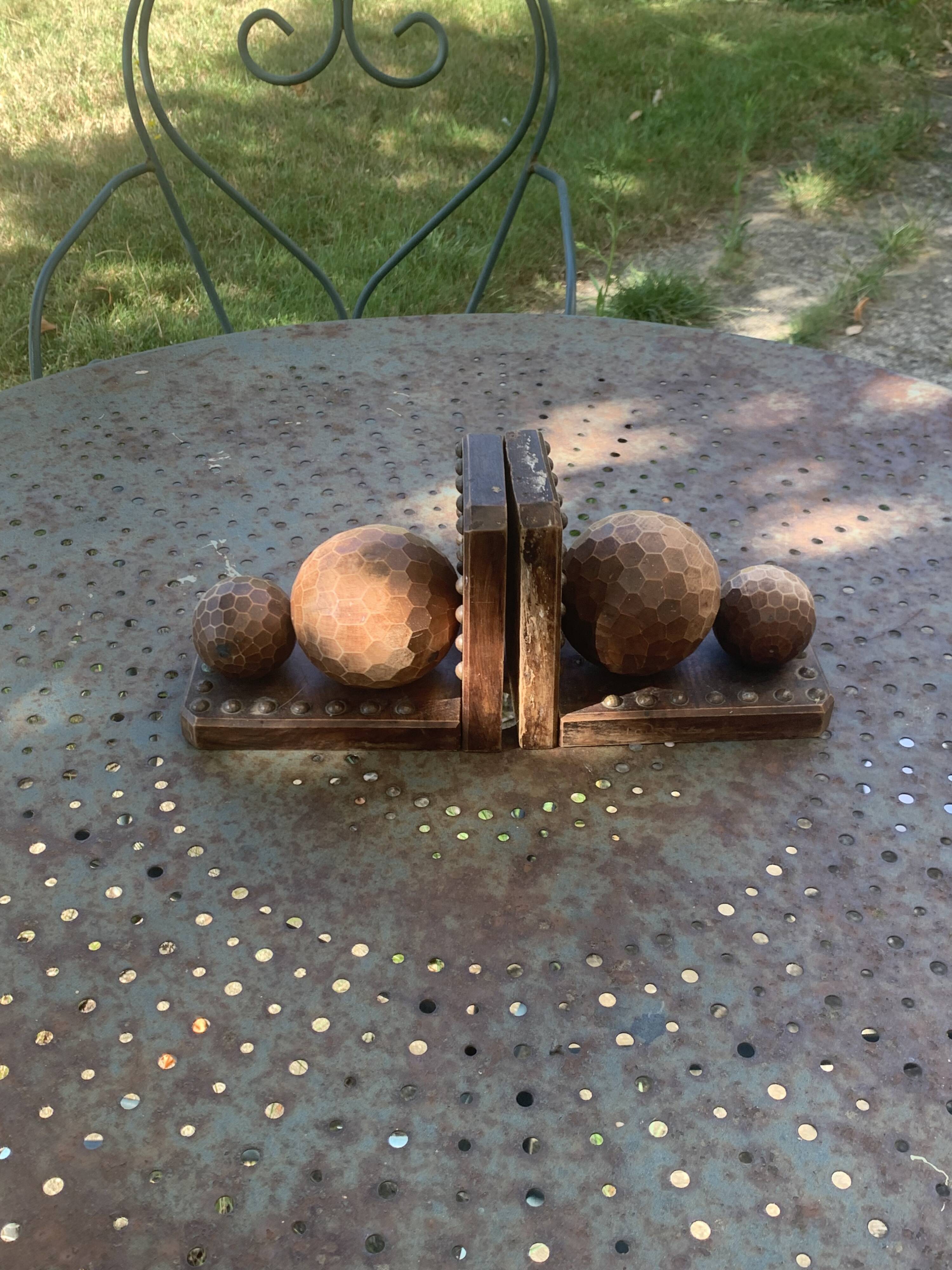 Pair of vintage carved wood and metal ball bookends