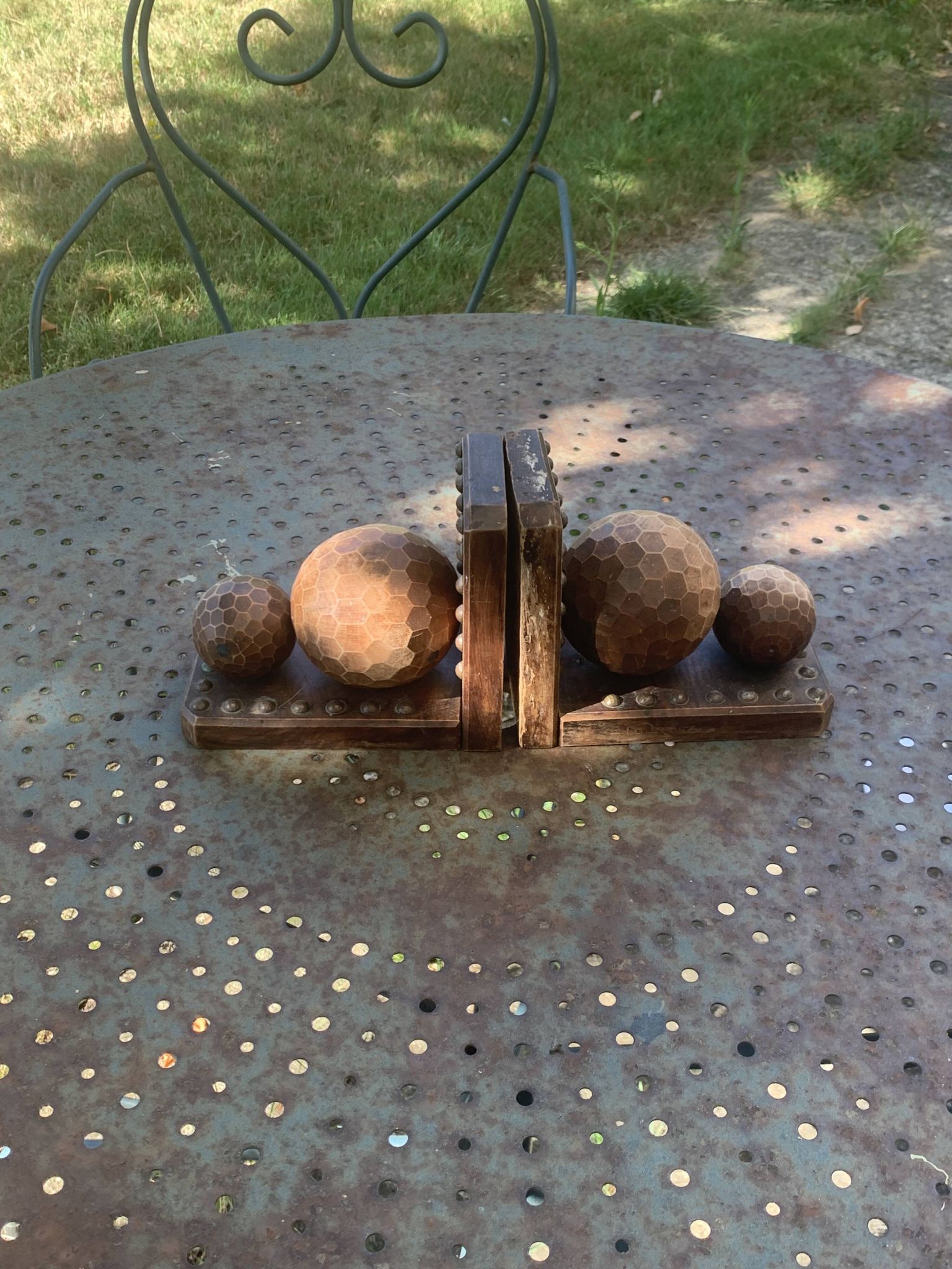 Pair of vintage carved wood and metal ball bookends