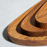 Trio of rounded triangular shaped trays or cups in monoxyl teak