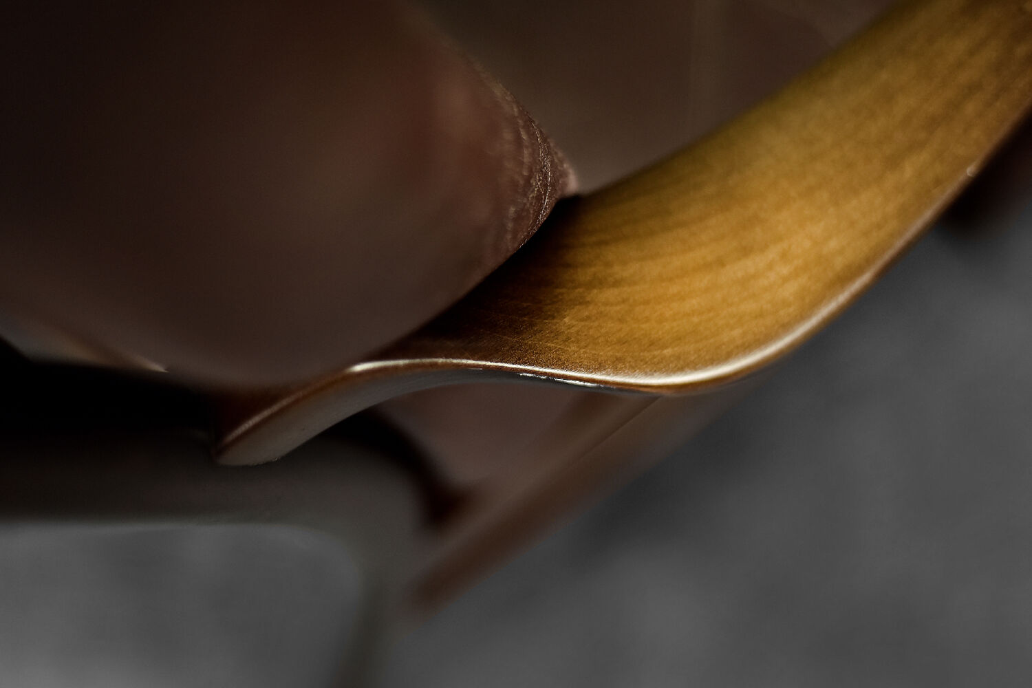 Modern vintage Danish armchair in beech and brown leather by Farstrup Møbler, 1970.