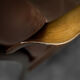 Modern vintage Danish armchair in beech and brown leather by Farstrup Møbler, 1970.