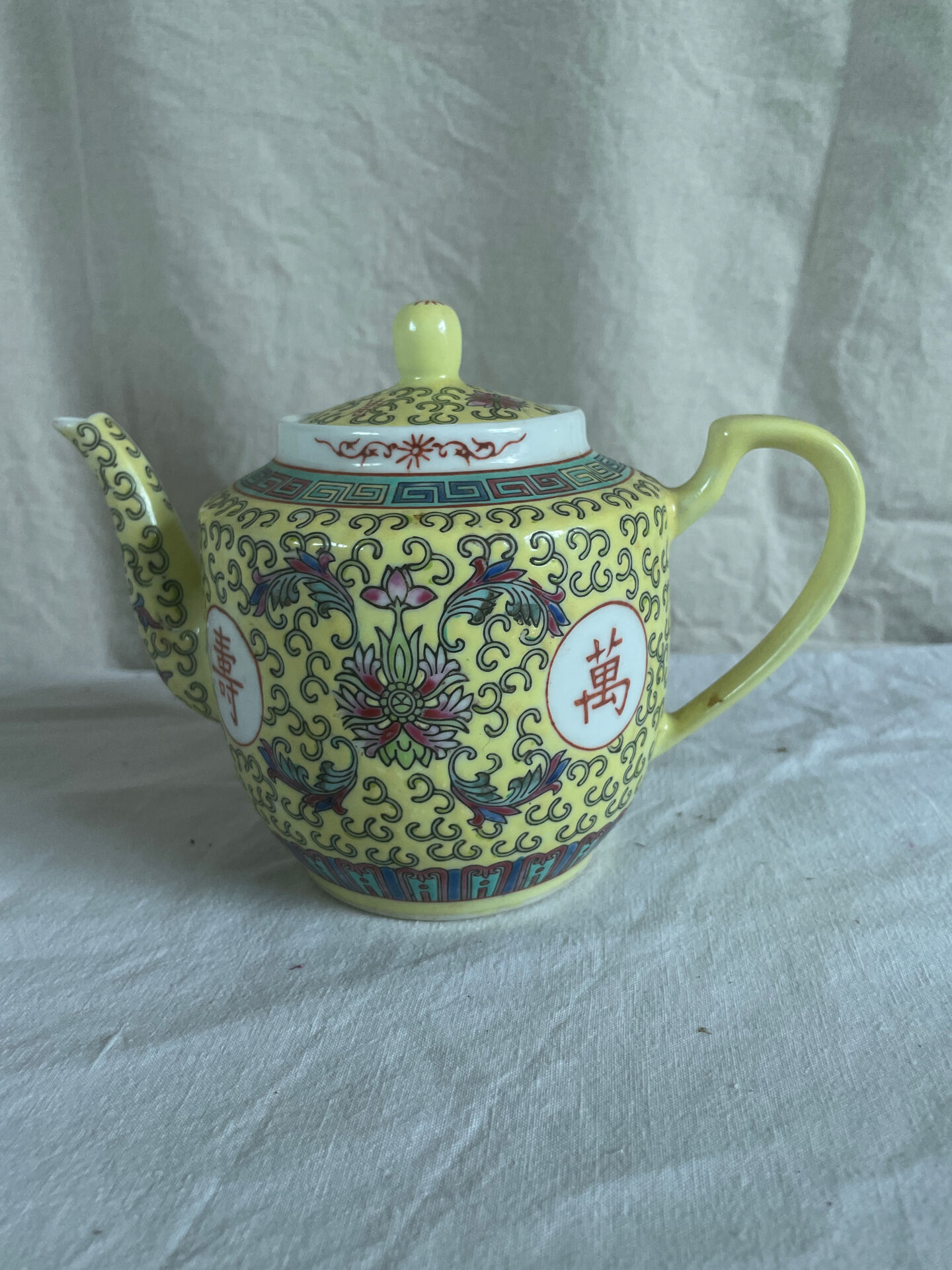 Chinese porcelain teapot with floral pattern