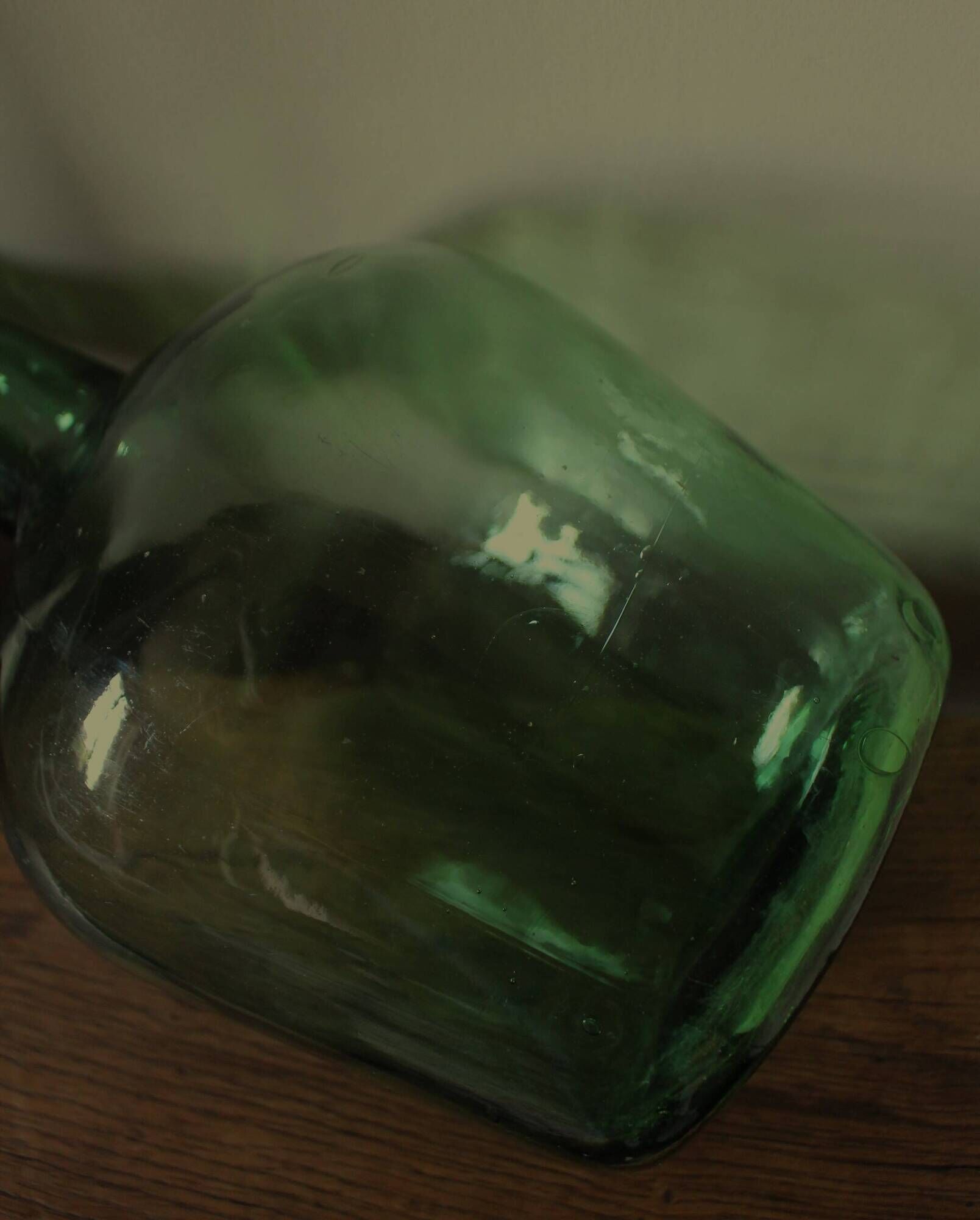 Dame Jeanne carboy from the Viresa collection in dark green glass