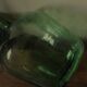Dame Jeanne carboy from the Viresa collection in dark green glass