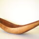Brutalistic cut in exotic wood boomerang shape