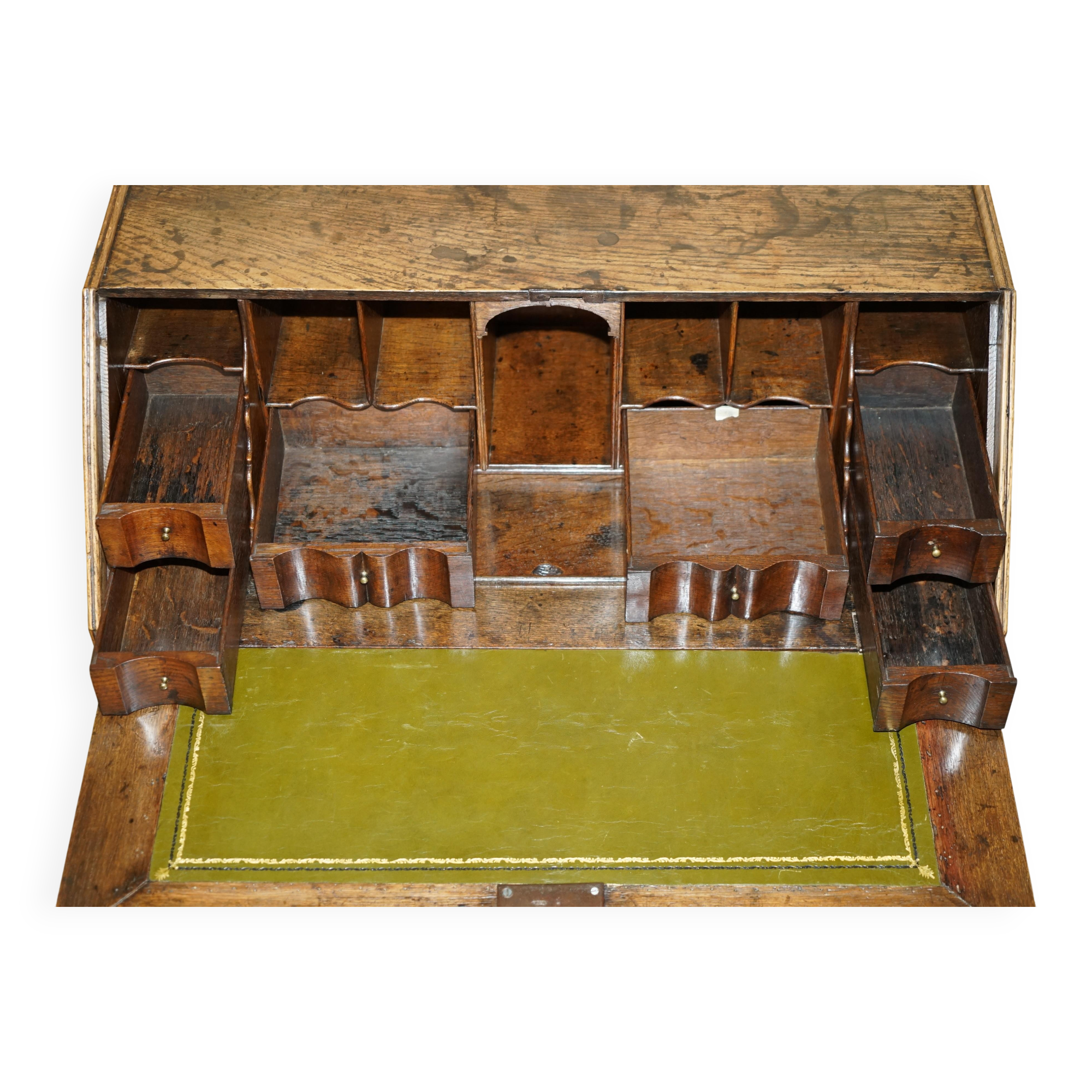 Ancient Georgian writing desk circa 1760 with a leather top.