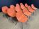 Set of 12 orange Guariche chairs