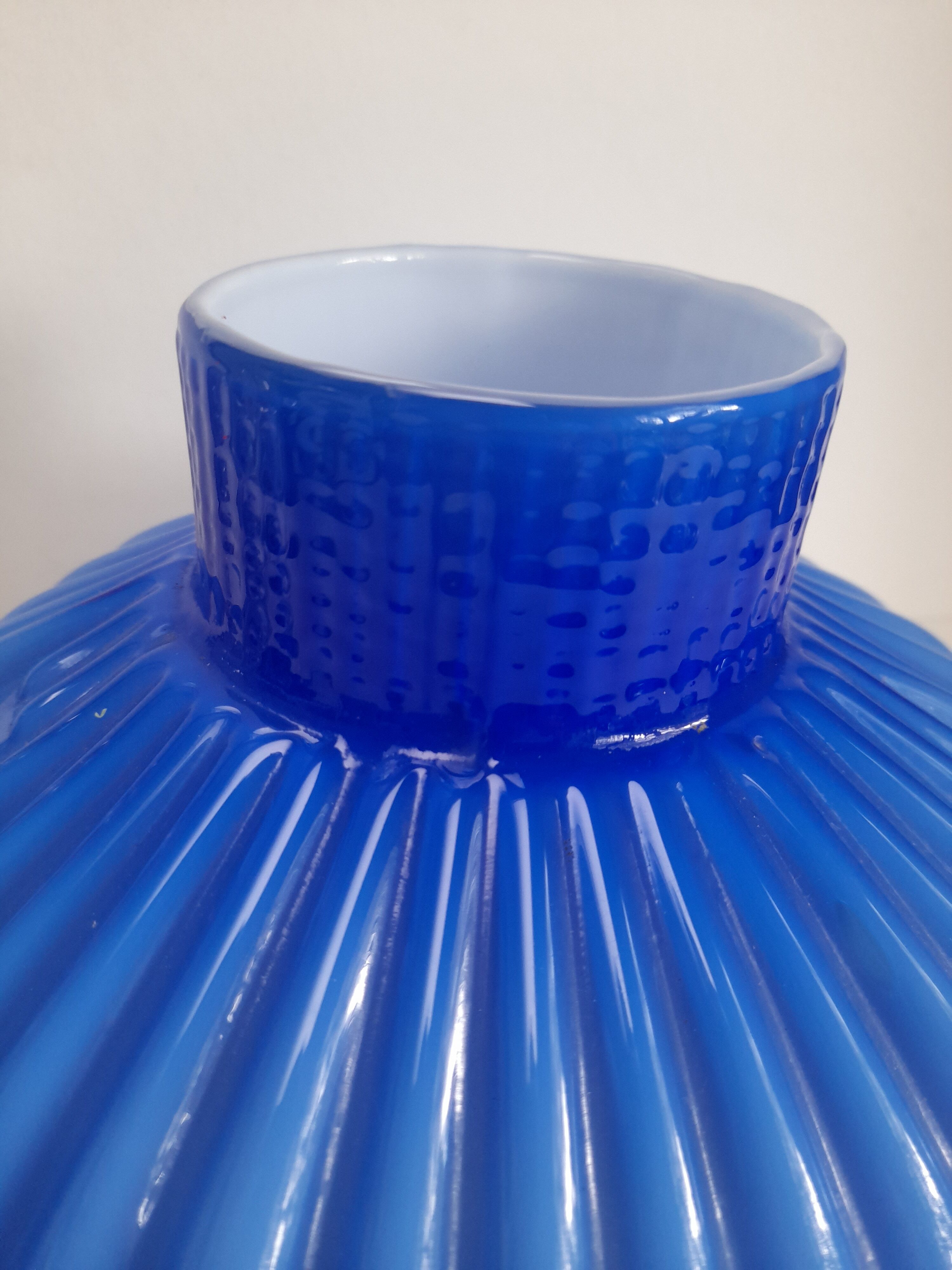 Blue opaline vase with a round handle