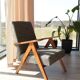 Vintage design armchair in mixed black fabric, walnut-coloured wood.