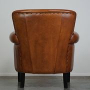 Fauteuil en cuir de mouton à l'aspect luxueux