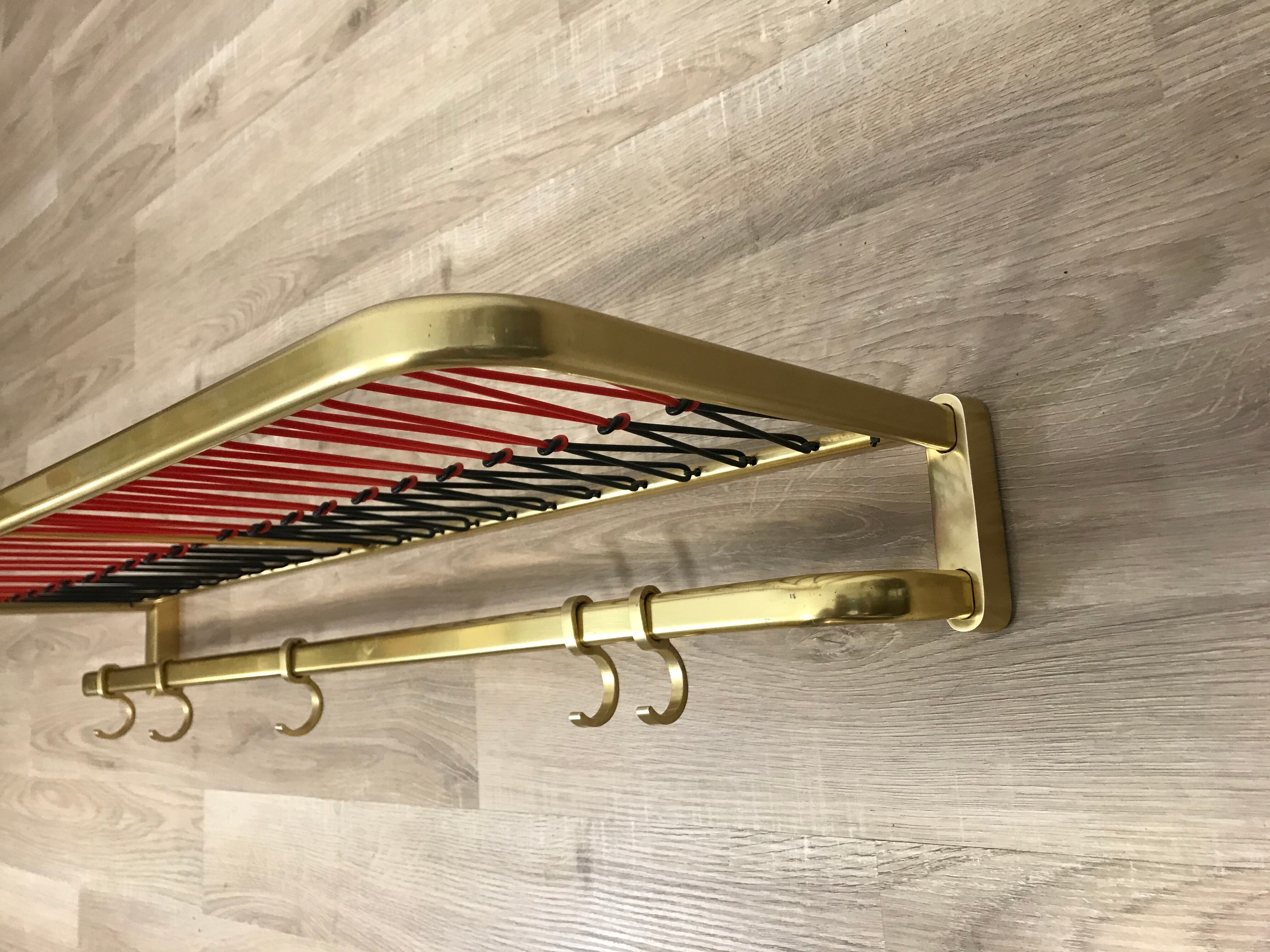Coat rack with scoubidou shelf