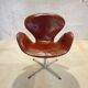 First edition Arne Jacobsen Swan chair, original patinated leather, 1950s