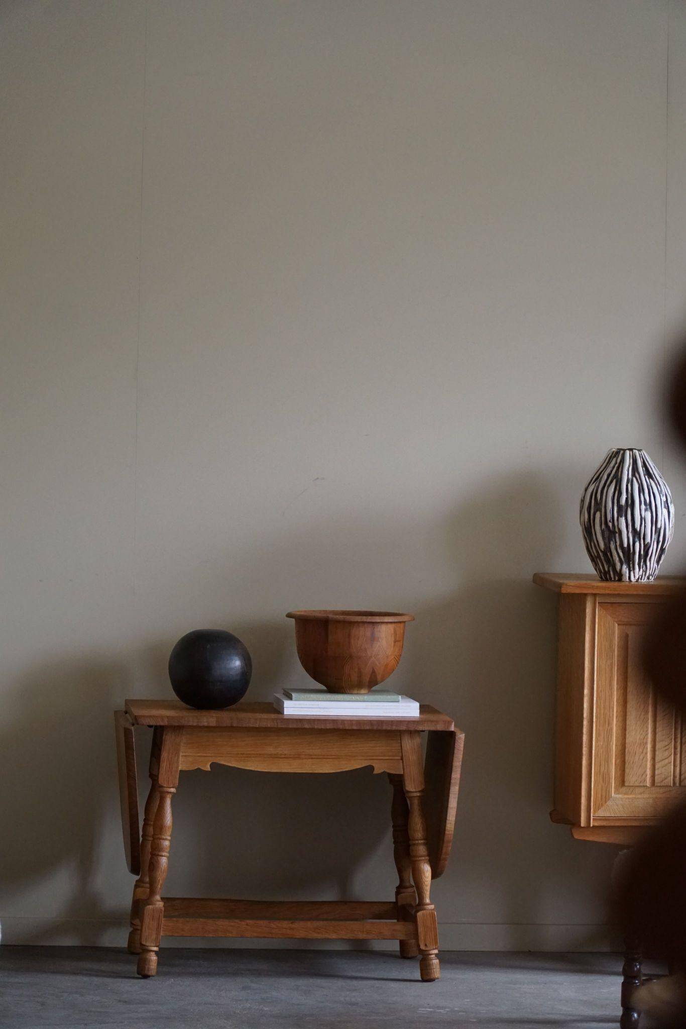 Danish mid-century folding side table in oak, Henning Kjærnulf, 1960s.