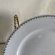12 white porcelain plates with silver edging