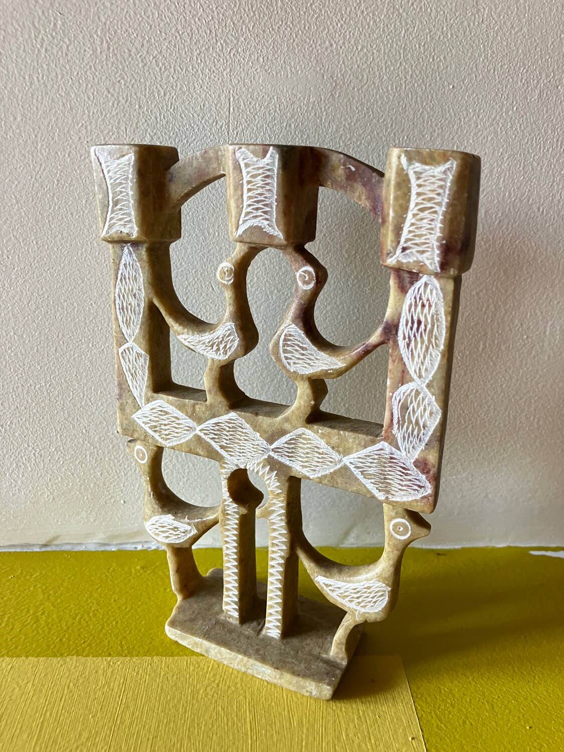 Vintage stone folk art candle holder