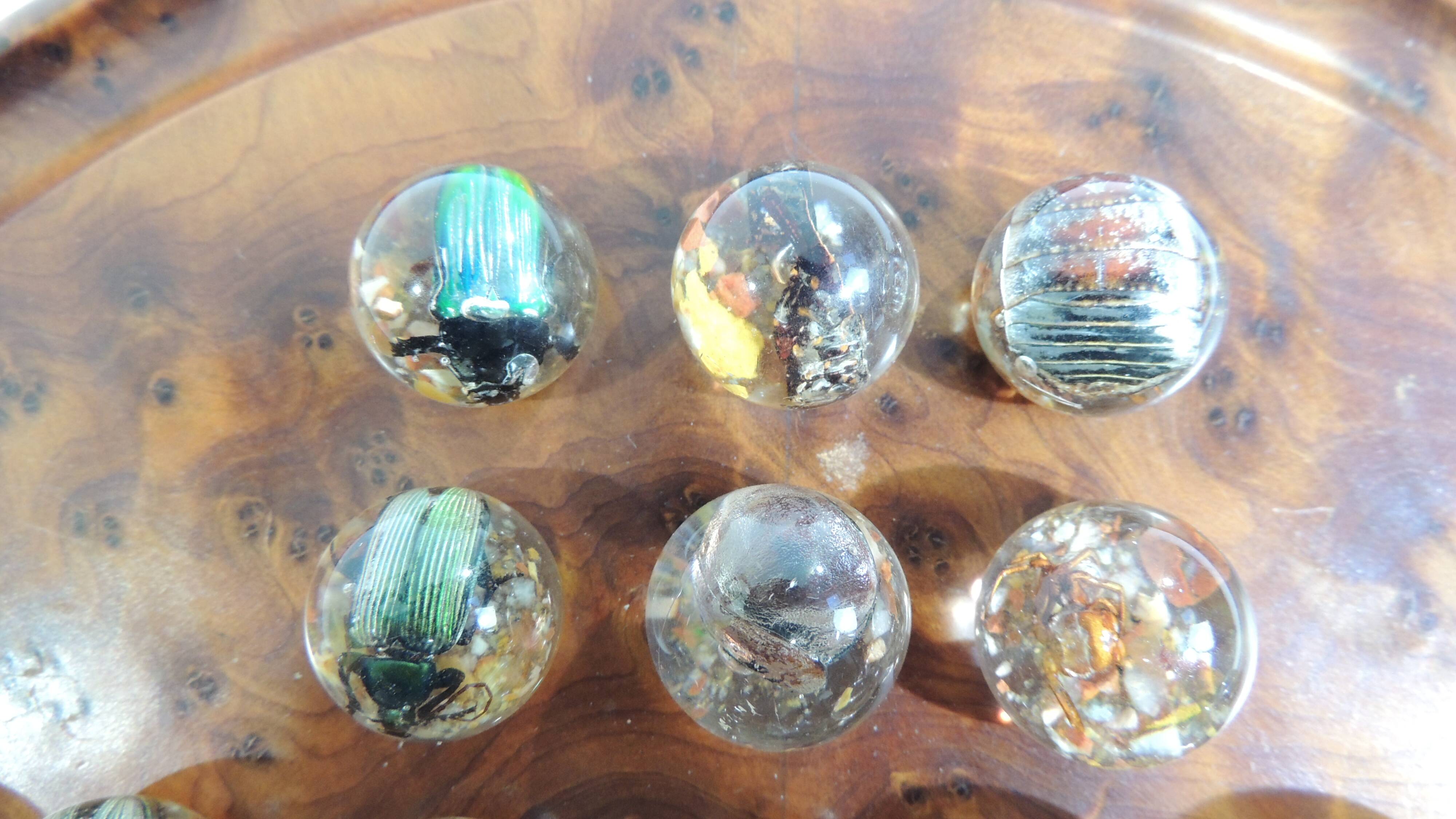 Vintage wooden solitaire game with resin balls and insects – Madaga