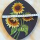 Decorative wall plate with sunflowers.