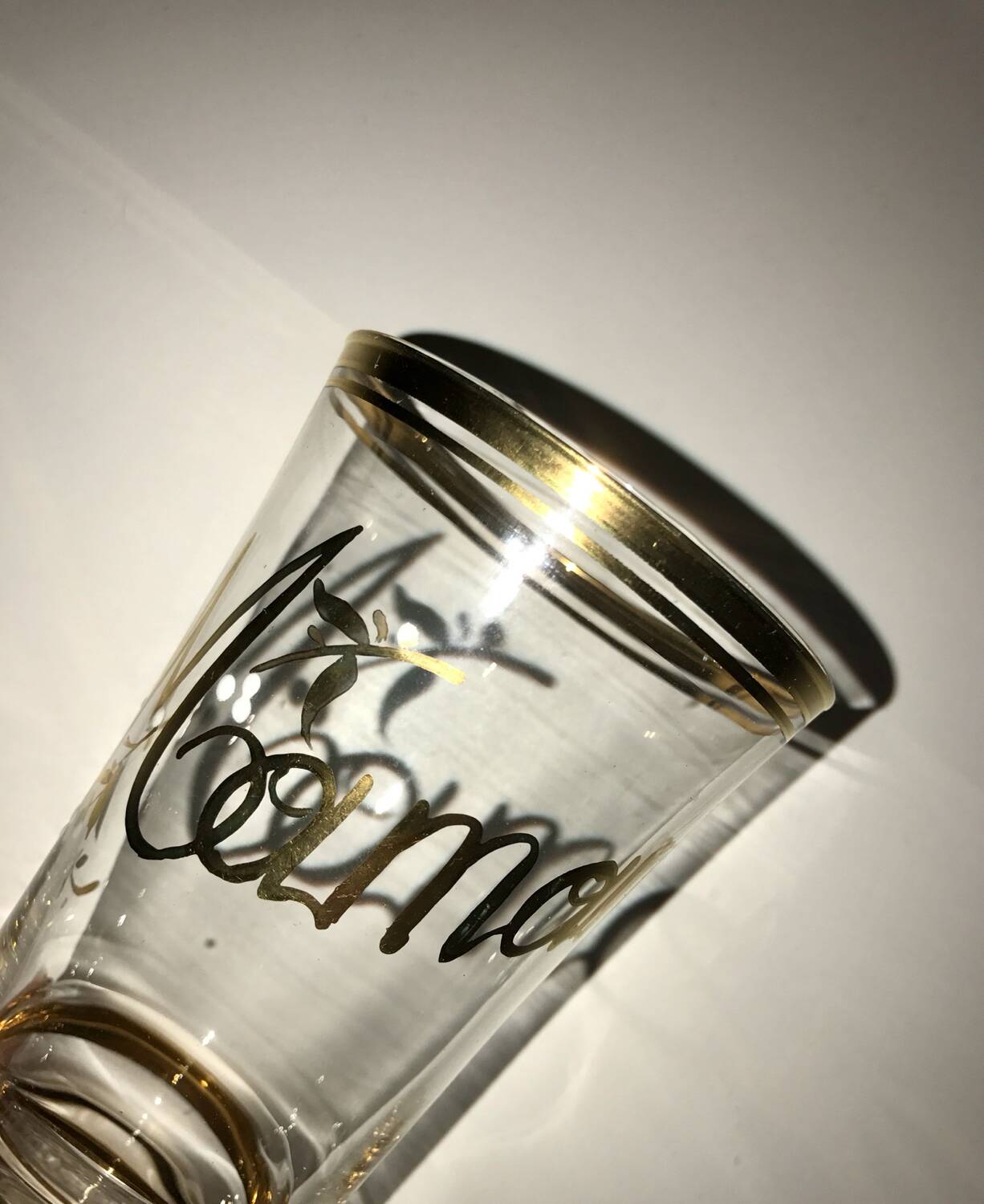 Antique gilded glass with the inscription Maman