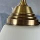 Pair of opaline glass pendant lights in white by Philips and brass from the 1920s.
