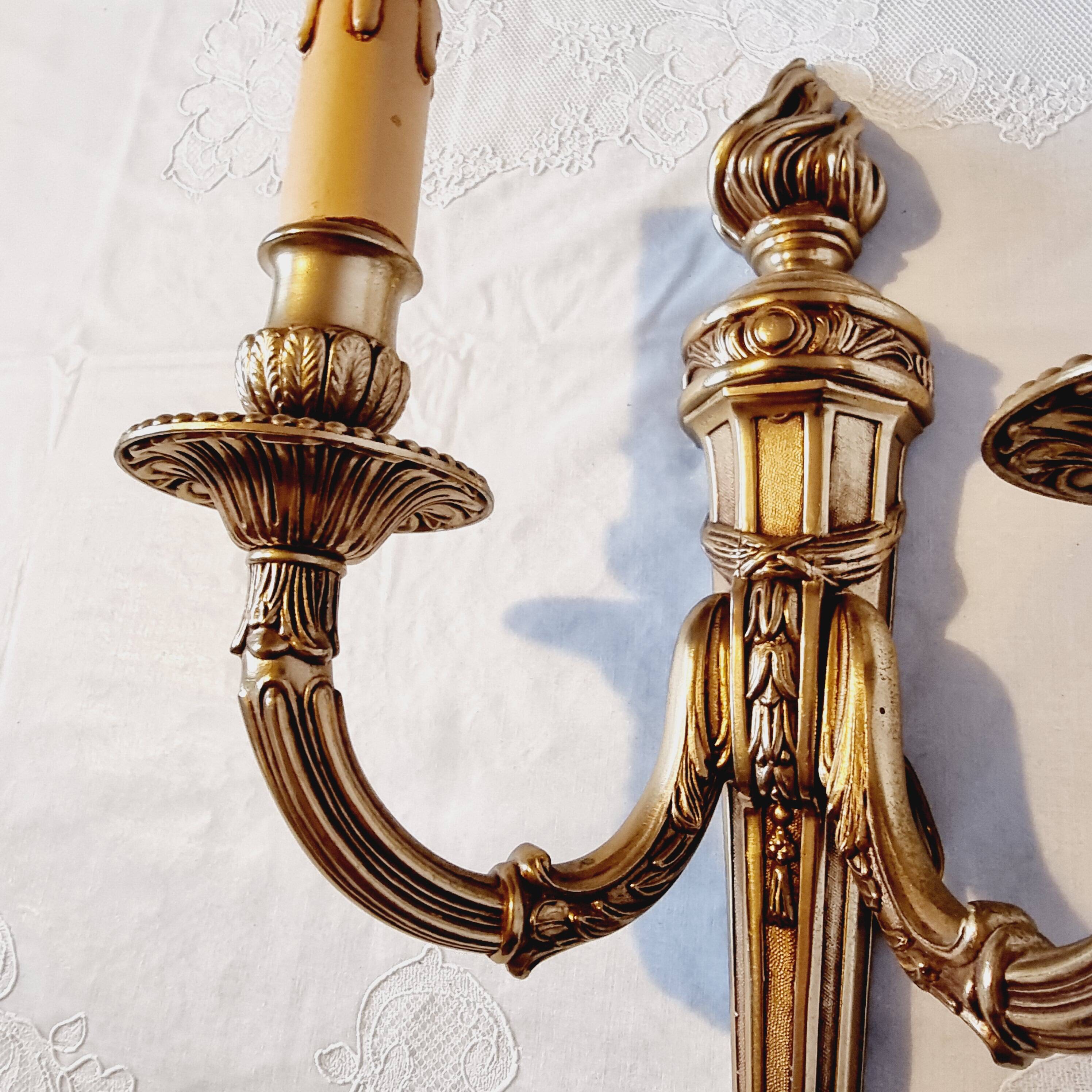 Pair of Louis XV style rocaille two-armed sconces in gilded bronze