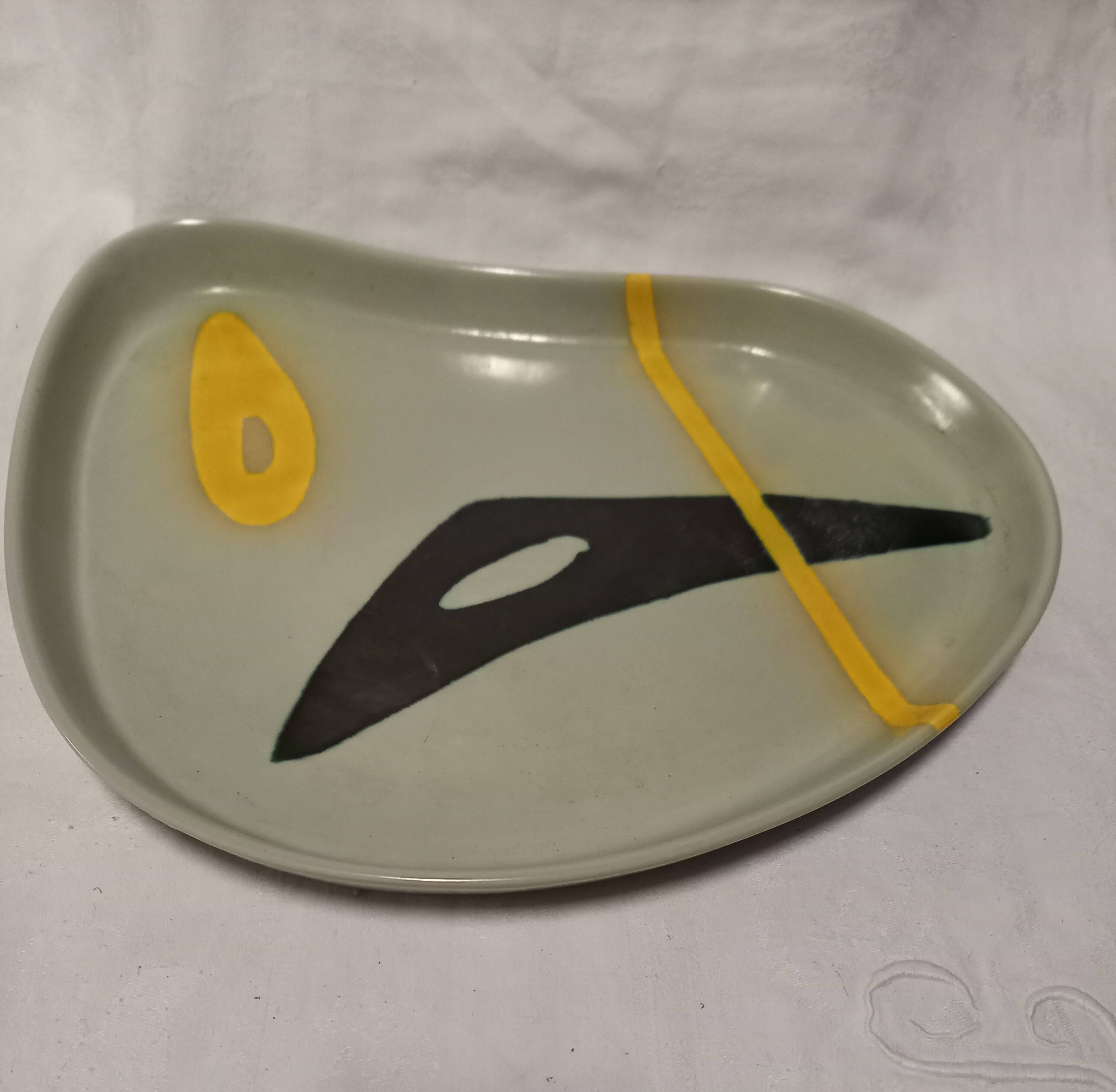Ceramic dish by Peter Orlando, free form with abstract decoration, 1950s