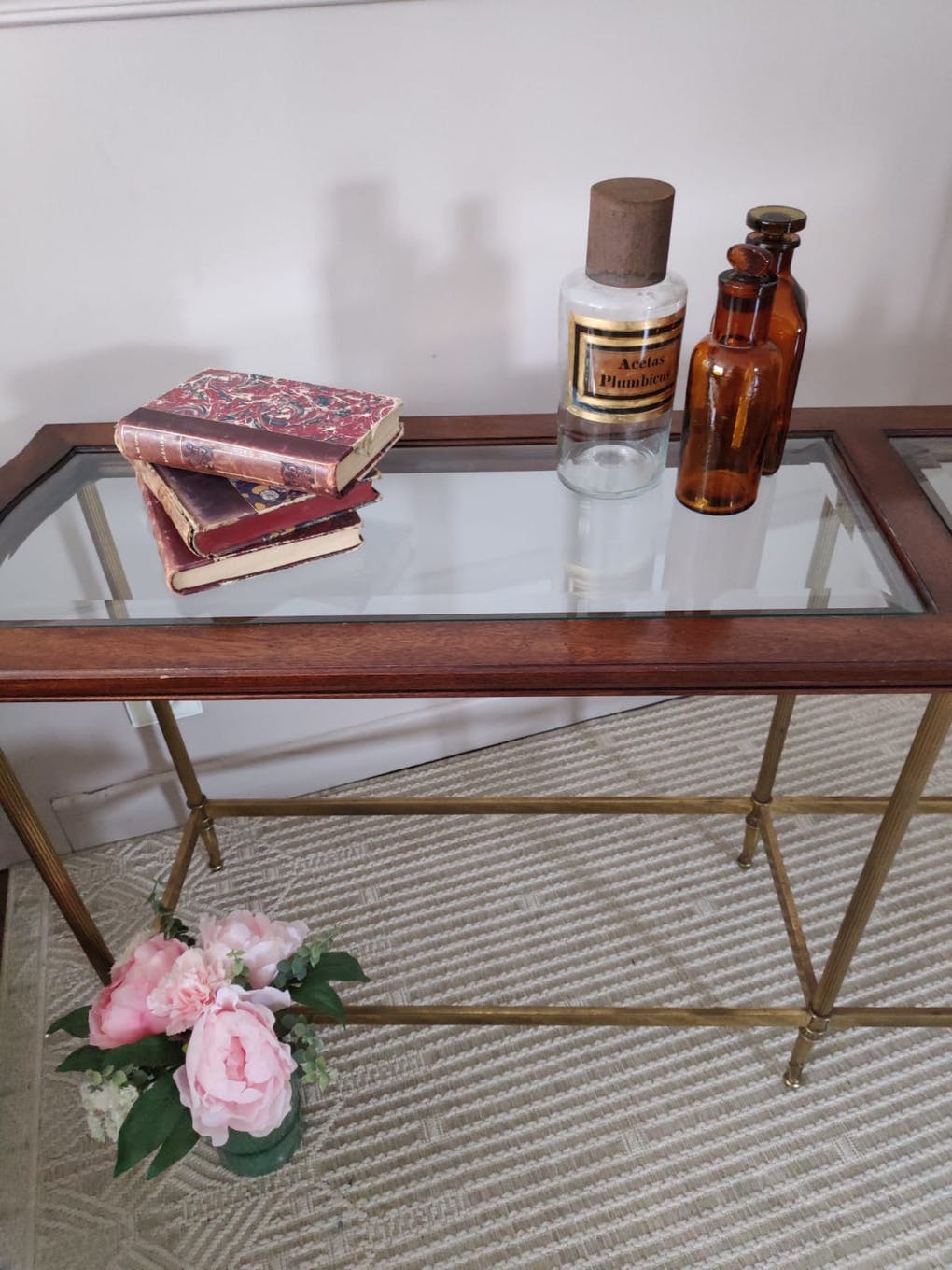 Glass and brass console table