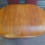 Round table with walnut shutter with extension