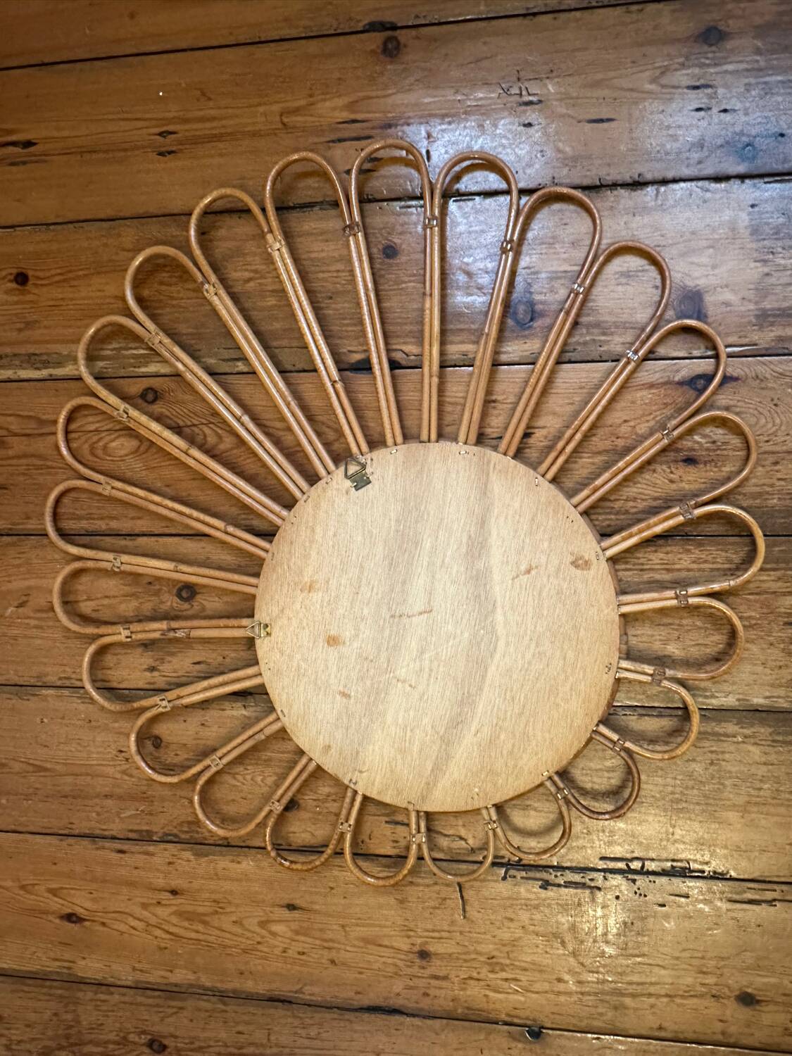 Old vintage asymmetrical round rattan mirror