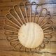 Old vintage asymmetrical round rattan mirror