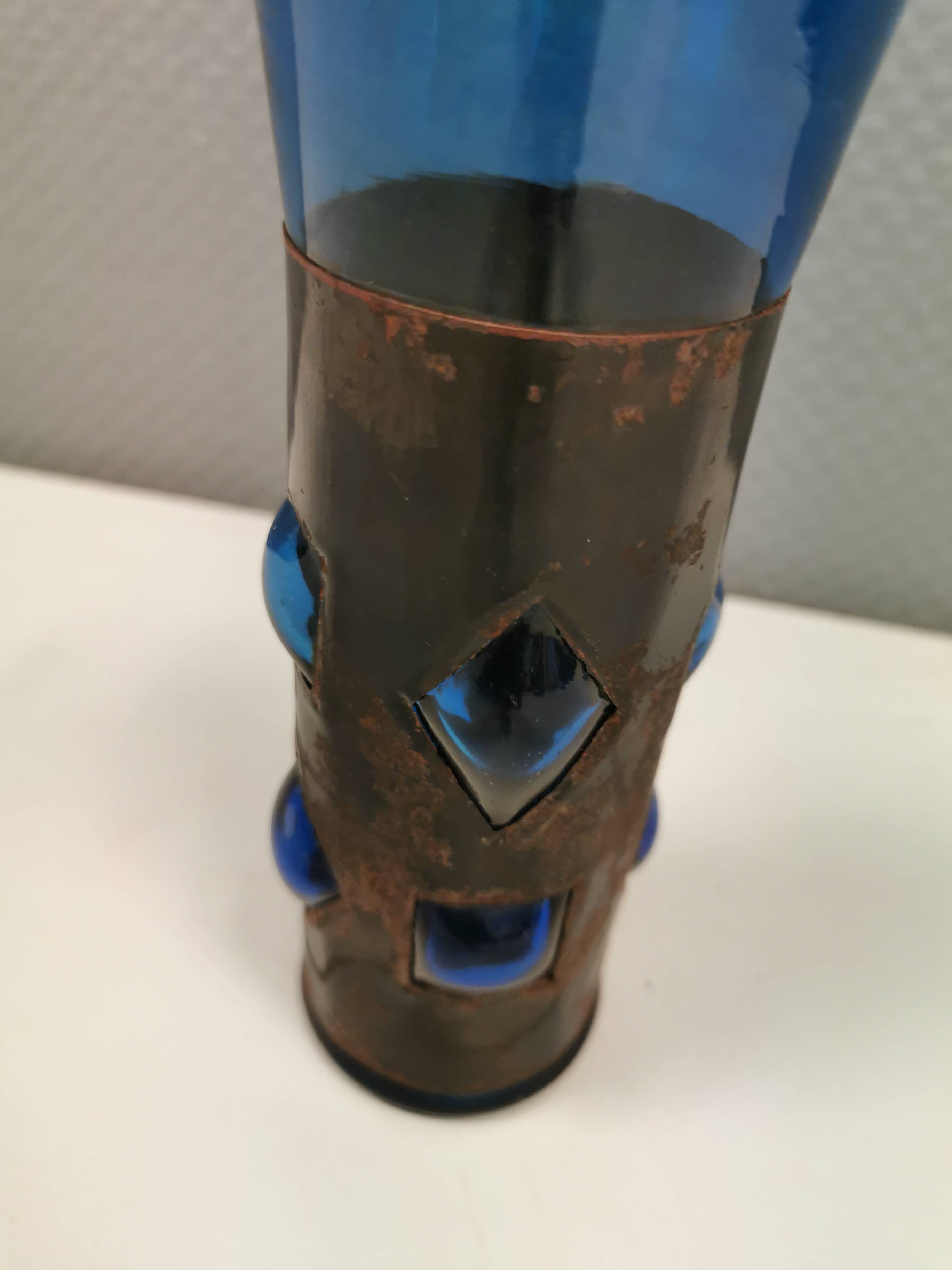 Brutalist style vase with inner blue glass mouth-blown out through the metal "frame".