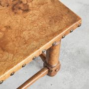Brutalist coffee table in solid oak, metal, and patinated leather, 1940s.