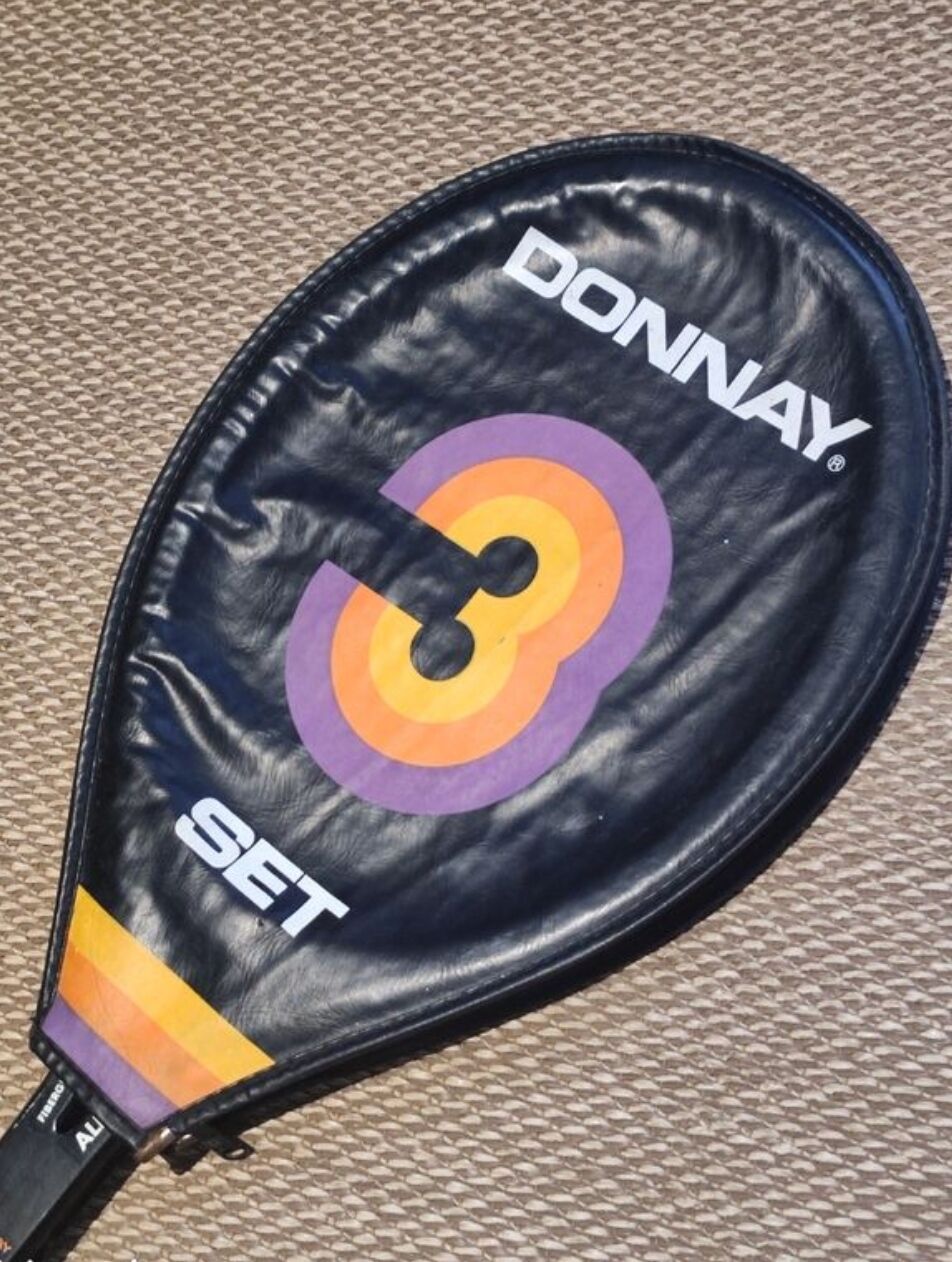 Tennis racket and its vintage cover