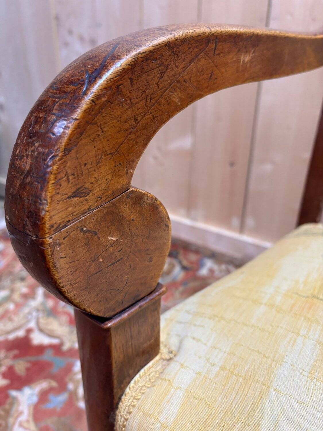 Pair of 19th-century armchairs with a scrolled back