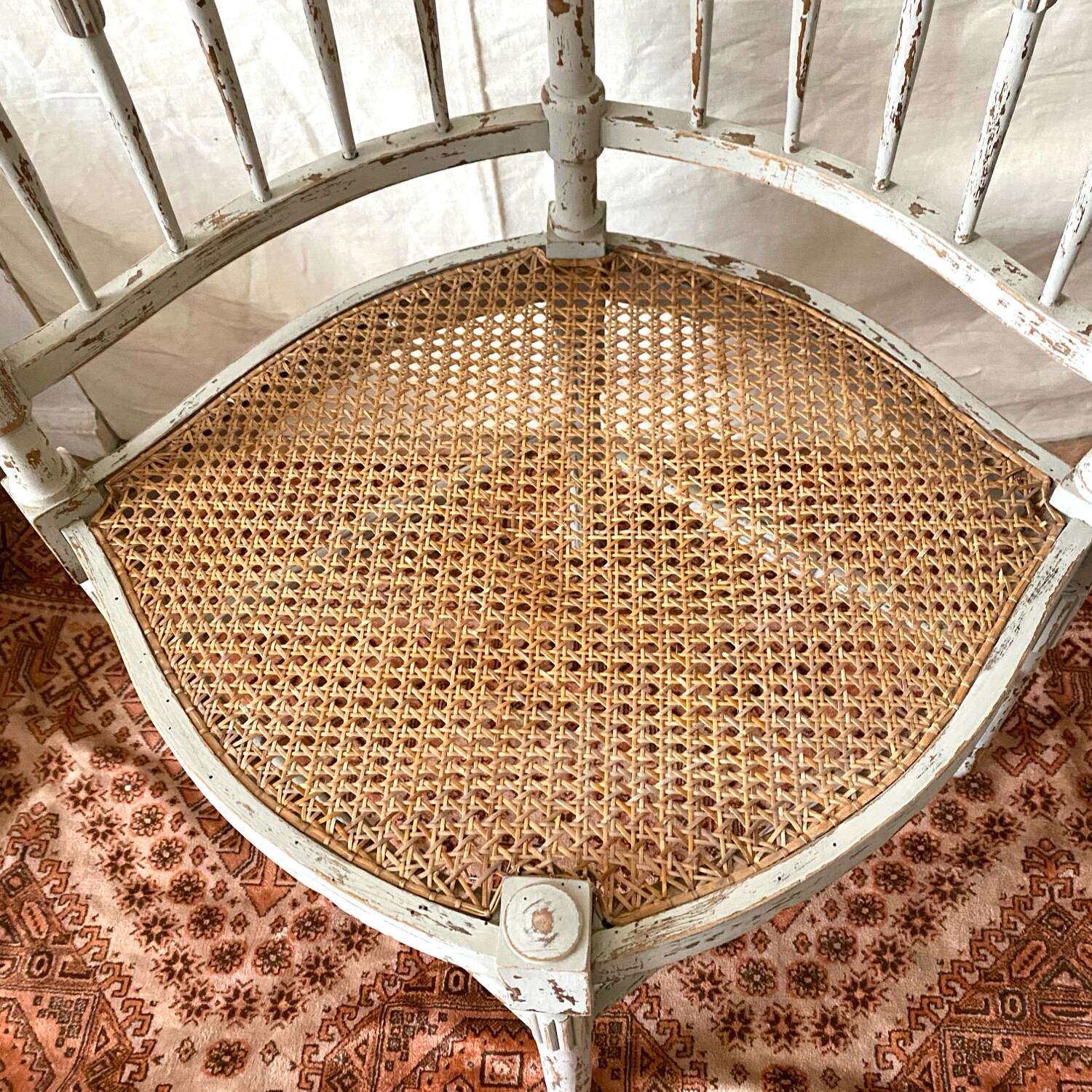 19th-century corner fireplace armchair, wood and cane.