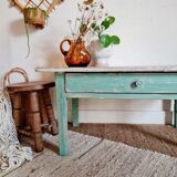 Wooden farmhouse coffee table green base