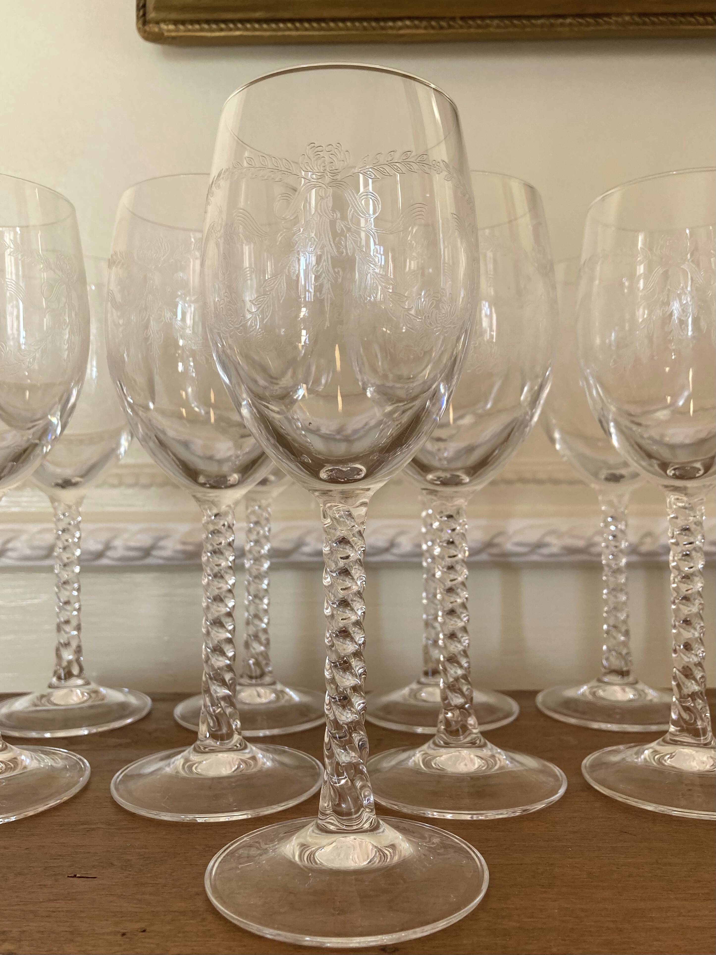 Set of 9 tall twisted and engraved crystal wine glasses