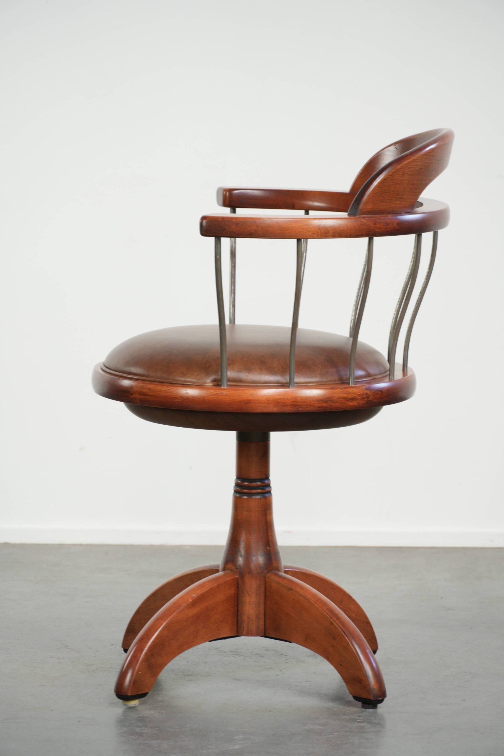 Swivel side chair / office chair with a cognac-coloured cow leather seat