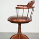 Swivel side chair / office chair with a cognac-coloured cow leather seat