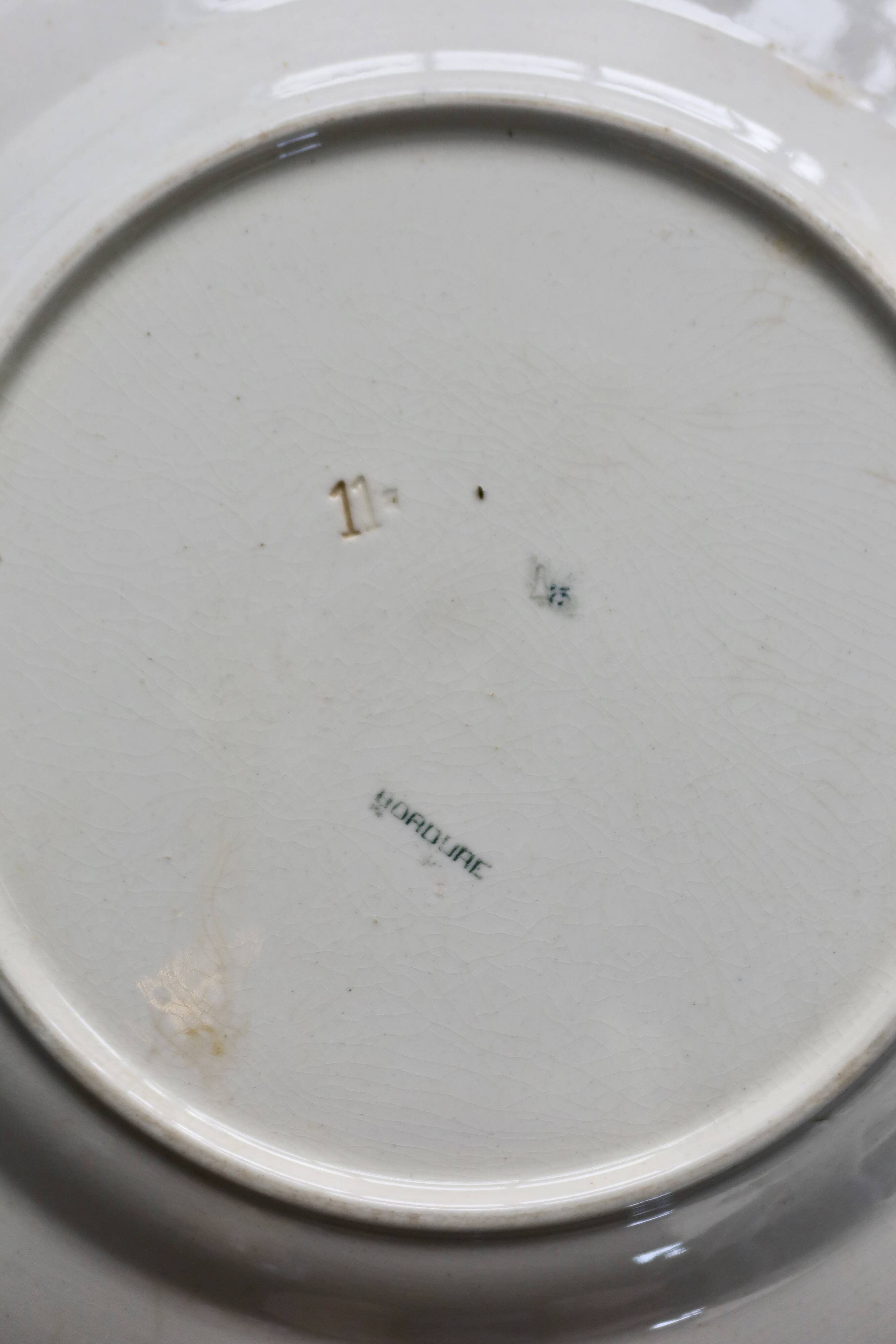 Round vintage patinated ironstone serving dish - Border model